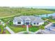 Aerial view of the clubhouse with manicured landscape and ample parking, perfect for community events and recreation at 6203 Grandview Hill Ct, Bradenton, FL 34203