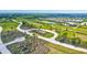 Aerial view of the walking trails in the community park featuring exercise stations and lush landscaping at 6203 Grandview Hill Ct, Bradenton, FL 34203