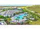 Aerial shot of community pool, lounge chairs, and cabanas offer a relaxing outdoor space at 6203 Grandview Hill Ct, Bradenton, FL 34203