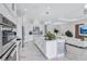 Spacious kitchen with state-of-the-art appliances, a center island and views to the dining area at 6203 Grandview Hill Ct, Bradenton, FL 34203
