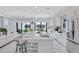 Bright, open kitchen features a large island, stainless appliances, and views of the backyard at 6203 Grandview Hill Ct, Bradenton, FL 34203