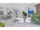 Open-concept living area with an island kitchen, marble floors, and a modern aesthetic at 6203 Grandview Hill Ct, Bradenton, FL 34203