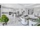Open-concept living space showcasing a modern kitchen, cozy living area, and elegant dining space at 6203 Grandview Hill Ct, Bradenton, FL 34203