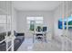 Well-lit office space with white marble floors, modern furniture, and stylish French doors at 6203 Grandview Hill Ct, Bradenton, FL 34203