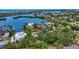 Stunning aerial view of a waterfront property nestled among lush trees with access to the bay at 6343 Hollywood Blvd, Sarasota, FL 34231