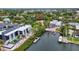 Picturesque aerial shot of a waterfront property, featuring a private dock and lush landscaping at 6343 Hollywood Blvd, Sarasota, FL 34231