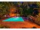 Backyard pool with a patio, lush foliage, outdoor grill, and lounge chairs; perfect for relaxing at 6343 Hollywood Blvd, Sarasota, FL 34231