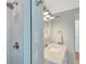 Bathroom with a tile walk-in shower and vanity with marble countertop at 6343 Hollywood Blvd, Sarasota, FL 34231