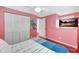 Cozy bedroom featuring hardwood floors, a ceiling fan, and a white closet with louvered doors at 6343 Hollywood Blvd, Sarasota, FL 34231