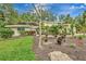 Charming single-Gathering home featuring well-maintained landscaping and vibrant foliage at 6343 Hollywood Blvd, Sarasota, FL 34231