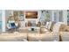 Spacious living room with tan leather sectional sofa, ceiling fan, and decorative fireplace at 6343 Hollywood Blvd, Sarasota, FL 34231