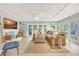 Spacious living room with tan leather sectional sofa, ceiling fan, and decorative fireplace at 6343 Hollywood Blvd, Sarasota, FL 34231