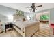 This main bedroom features a clawfoot tub with an exterior view and an overhead fan at 6343 Hollywood Blvd, Sarasota, FL 34231