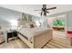 This main bedroom features a clawfoot tub with an exterior view and an overhead fan at 6343 Hollywood Blvd, Sarasota, FL 34231