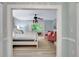 This main bedroom features a clawfoot tub with an exterior view and two stylish pink chairs at 6343 Hollywood Blvd, Sarasota, FL 34231