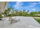 Outdoor patio with lounge chairs surrounded by tropical foliage and landscaping at 6343 Hollywood Blvd, Sarasota, FL 34231