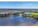 Expansive aerial view of a community with lakes, golf courses, and residential buildings at 6509 Grand Estuary Trl # 203, Bradenton, FL 34212