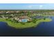 Scenic aerial view of the community showcasing the pool, tennis courts, and surrounding landscape at 6509 Grand Estuary Trl # 203, Bradenton, FL 34212