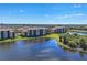 Scenic waterfront condo complex with lush green lawns and beautiful views of the surrounding water and landscape at 6509 Grand Estuary Trl # 203, Bradenton, FL 34212