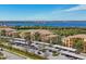 Elevated view of condos with carport parking near a golf course and waterfront at 6509 Grand Estuary Trl # 203, Bradenton, FL 34212