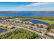 Beautiful aerial shot of condos with golf course, water views, parking and lots of green space at 6509 Grand Estuary Trl # 203, Bradenton, FL 34212