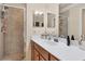 Bathroom with tile shower, modern vanity, and plenty of counter space at 6509 Grand Estuary Trl # 203, Bradenton, FL 34212