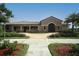 Attractive clubhouse with brick accents, well-manicured landscaping, and a welcoming entrance at 6509 Grand Estuary Trl # 203, Bradenton, FL 34212
