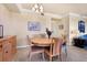 The dining room has a wood table with seating for four and a buffet for storage at 6509 Grand Estuary Trl # 203, Bradenton, FL 34212