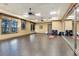 Spacious fitness room features ceiling fans, mirrors, and ample space for exercise and yoga at 6509 Grand Estuary Trl # 203, Bradenton, FL 34212