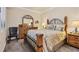 A view of the main bedroom with a four poster bed and decorative furnishings at 6509 Grand Estuary Trl # 203, Bradenton, FL 34212