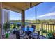 Enjoy the patio space with seating and views of the water and golf course at 6509 Grand Estuary Trl # 203, Bradenton, FL 34212