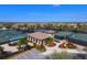 Aerial view of tennis courts and beautifully manicured landscaping in a lovely community at 6509 Grand Estuary Trl # 203, Bradenton, FL 34212
