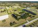 Breathtaking aerial shot showcasing vast land, serene ponds, and an equestrian area, perfect for an idyllic retreat at 6605 253Rd St E, Myakka City, FL 34251