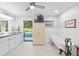 Bright bathroom featuring a soaking tub, white cabinets, and access to the pool area at 6605 253Rd St E, Myakka City, FL 34251