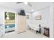 Charming bathroom with a clawfoot tub and view of the pool area outside at 6605 253Rd St E, Myakka City, FL 34251
