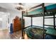Bedroom featuring a bunk bed, chest of drawers and modern fixtures at 6605 253Rd St E, Myakka City, FL 34251