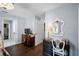 Bedroom with a desk, chair, and adjacent bathroom at 6605 253Rd St E, Myakka City, FL 34251