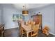 Elegant dining room with a large wooden table and chairs, perfect for Gathering gatherings and entertaining guests at 6605 253Rd St E, Myakka City, FL 34251