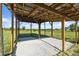 A horse shelter provides an open view of the pasture, offering a safe and comfortable space at 6605 253Rd St E, Myakka City, FL 34251