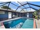 The private screened-in pool area offers a relaxing retreat for swimming and lounging at 6605 253Rd St E, Myakka City, FL 34251