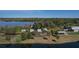 An aerial view showing the lakefront cottages nestled along the water's edge at 6702 Drewrys Blf, Bradenton, FL 34203