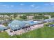 Stunning aerial view of the community clubhouse, golf carts and surrounding neighborhood at 6702 Drewrys Blf, Bradenton, FL 34203