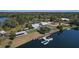 An aerial view of the charming community with lakeside cottages and docks at 6702 Drewrys Blf, Bradenton, FL 34203