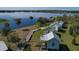 Aerial view showcasing lakefront cottages with wood boardwalks and lovely landscaping at 6702 Drewrys Blf, Bradenton, FL 34203