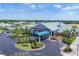 An aerial view of the clubhouse featuring manicured landscaping and well-maintained facilities at 6702 Drewrys Blf, Bradenton, FL 34203