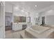 Large bathroom featuring a sunken tub, dual sinks, and plenty of counter space at 6702 Drewrys Blf, Bradenton, FL 34203