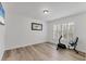 Bright bedroom with an exercise bike and large windows, perfect for a home gym at 6702 Drewrys Blf, Bradenton, FL 34203