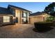 Charming single-story home with mature landscaping, paver driveway, and a welcoming blue front door at 6702 Drewrys Blf, Bradenton, FL 34203
