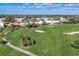 A serene view of the lush green golf course winding through a quiet neighborhood at 6702 Drewrys Blf, Bradenton, FL 34203
