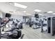 Well-equipped gym featuring state-of-the-art cardio and strength-training equipment on a wood floor at 6702 Drewrys Blf, Bradenton, FL 34203